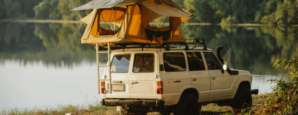 pop-up camper by lake
